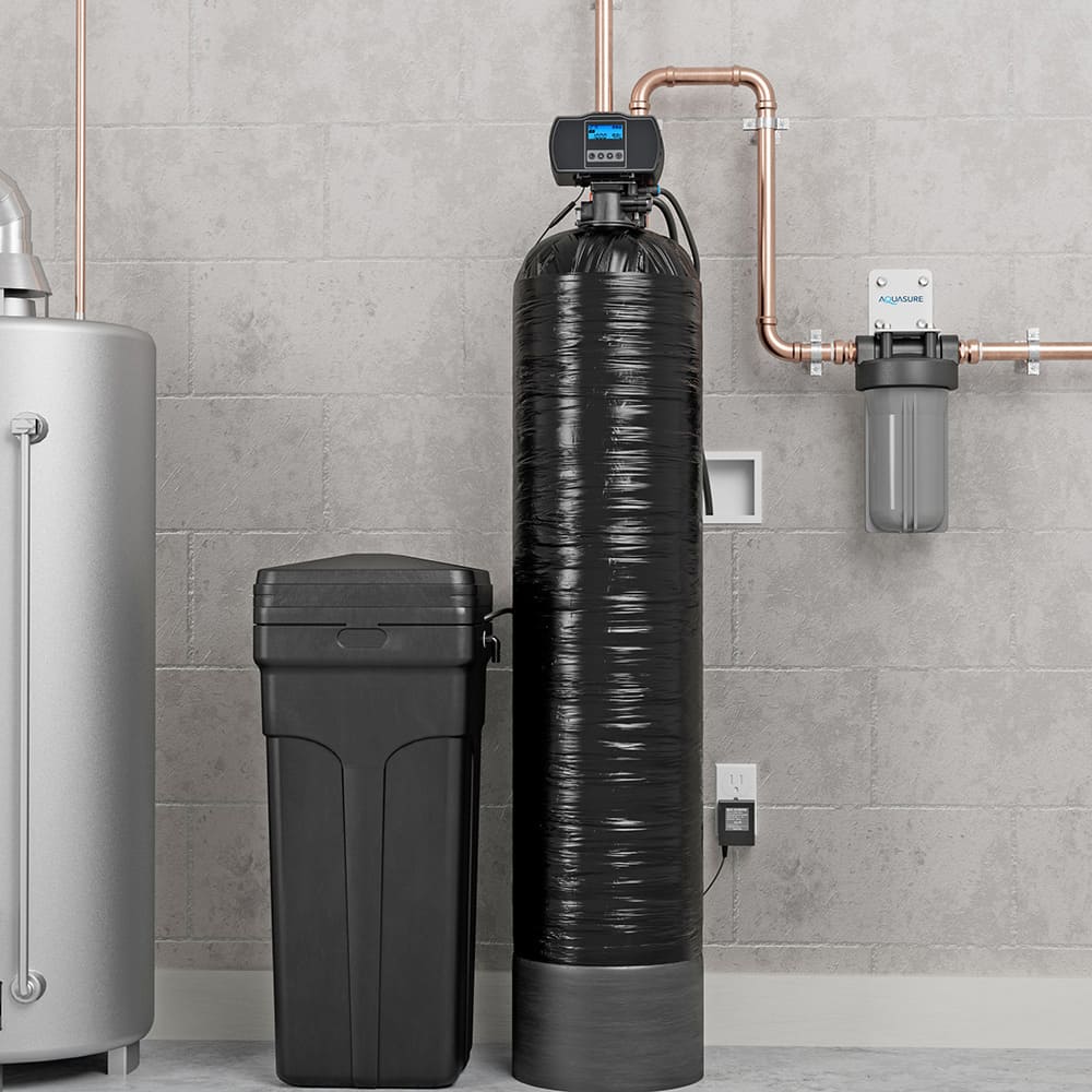 A water softener in a room with pipes.